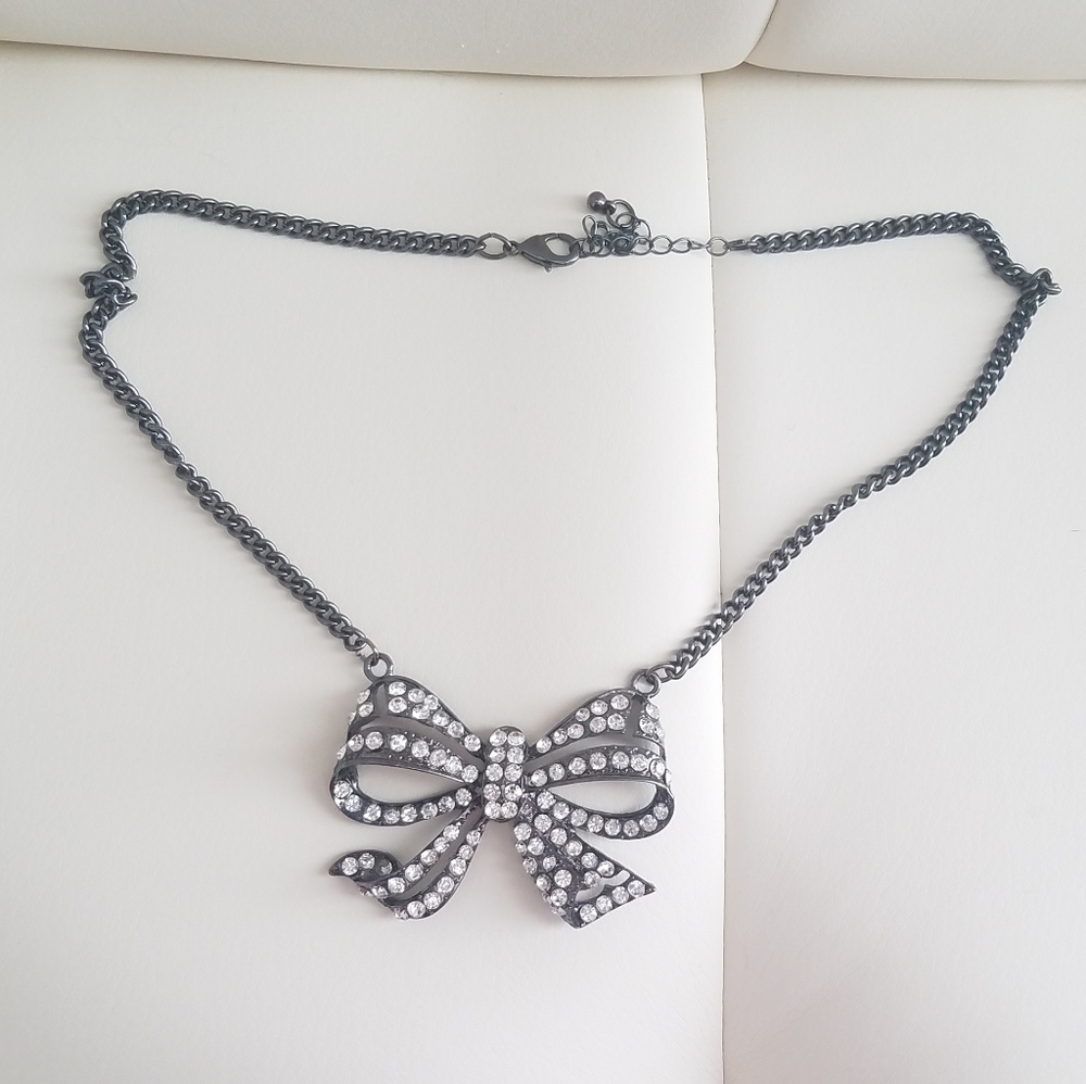 Gunmetal bow statement necklace